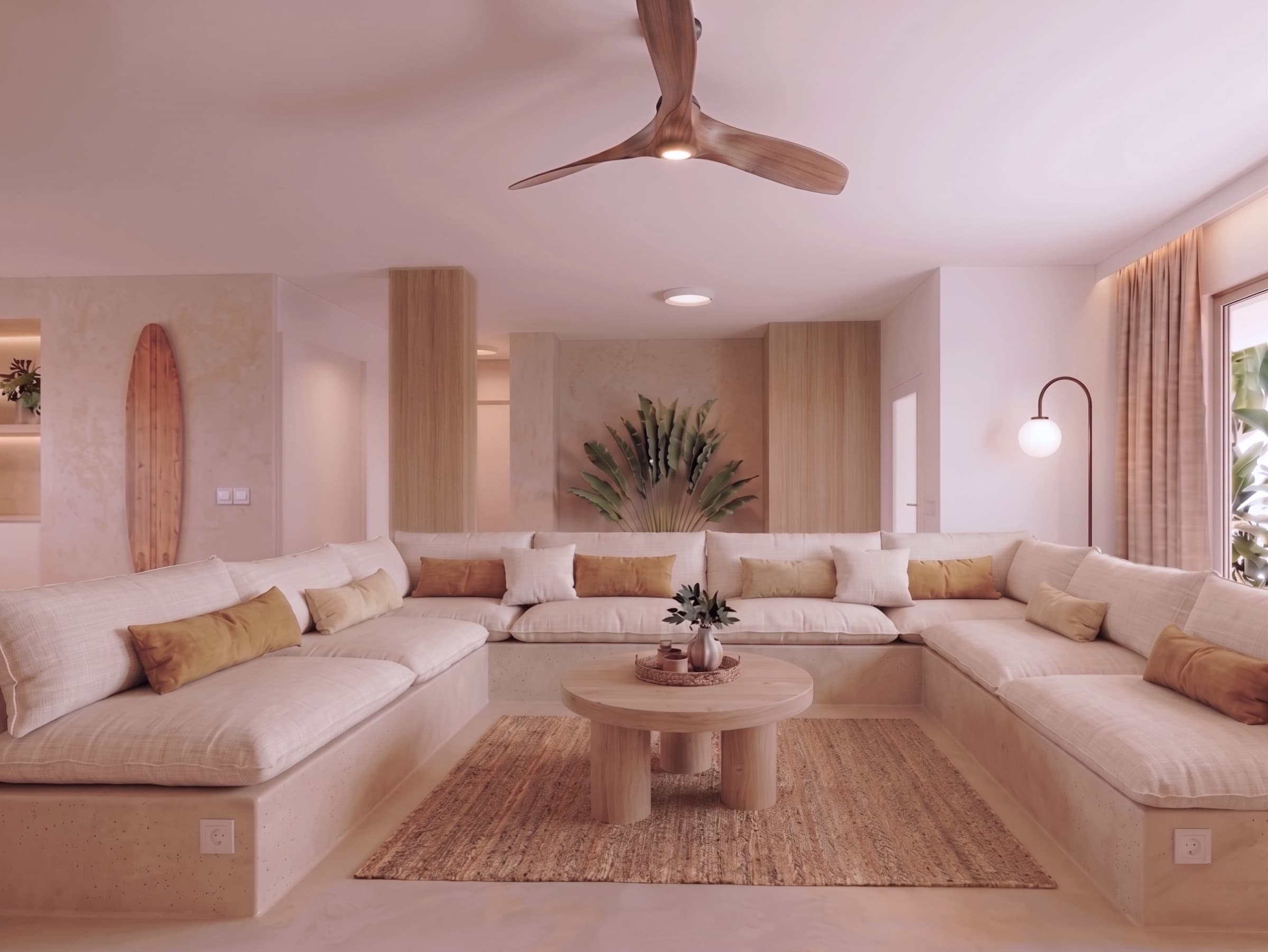 Sunken lounge with a wraparound sofa and a surfboard on the wall